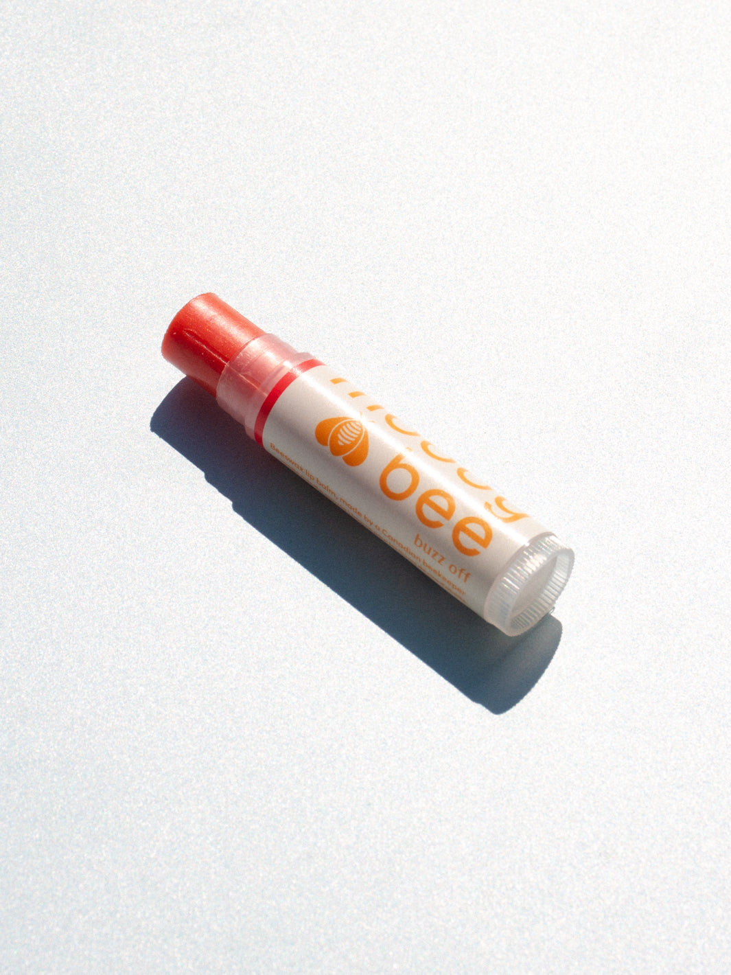 "buzz off" tinted lip balm