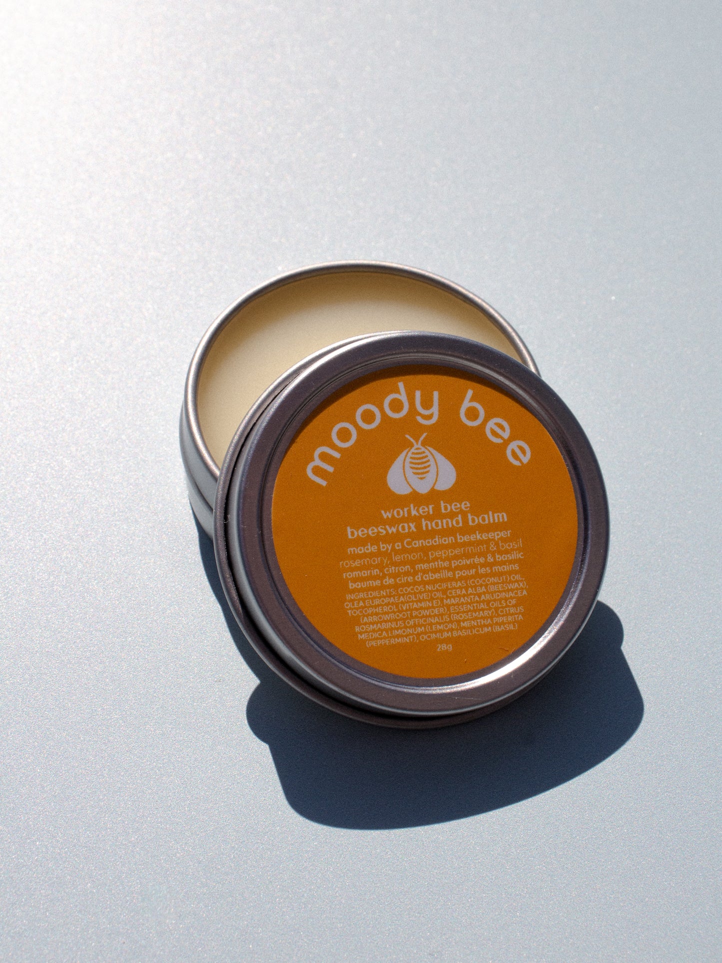 worker bee hand balm with essential oils of lemon, peppermint, rosemary & basil.